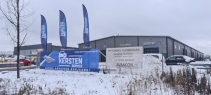 Kersten Service outside banner and flags installed
